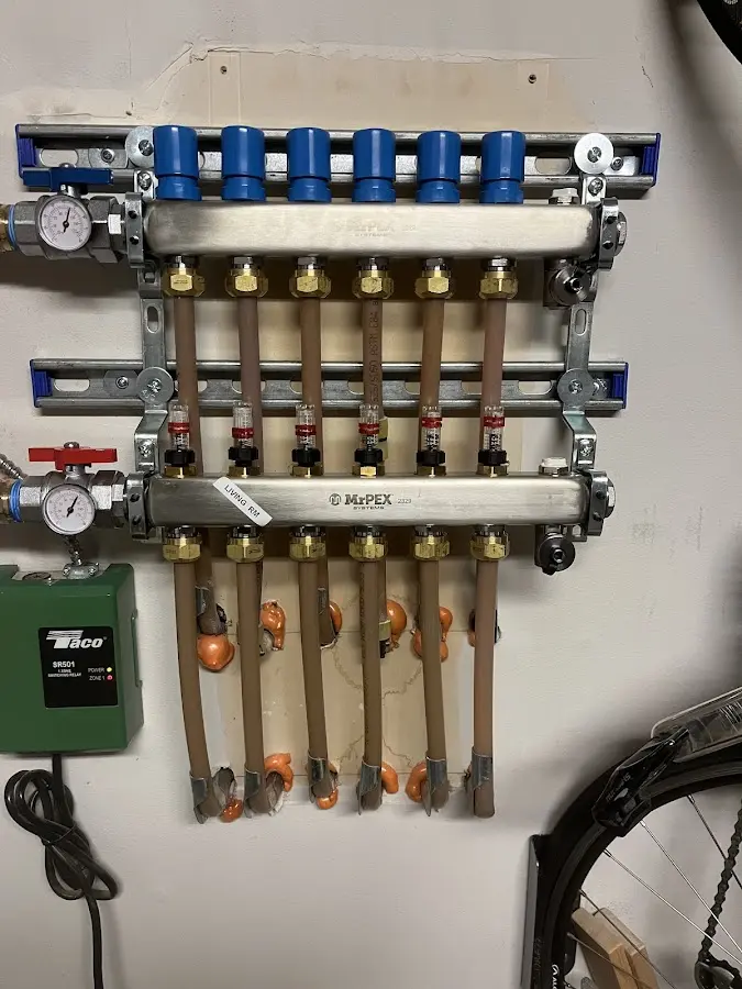 Plumber performing Gas Line Installation at a residential property in Elm Springs